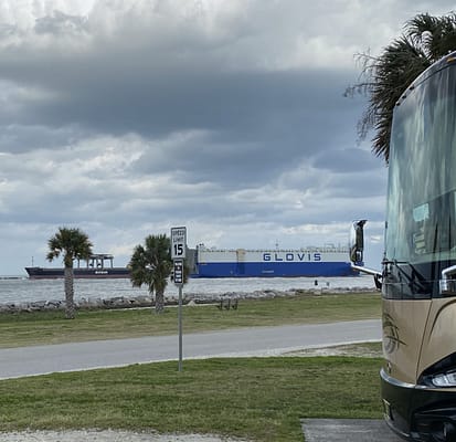 Ships sail in front of RVs at Mayport NAS